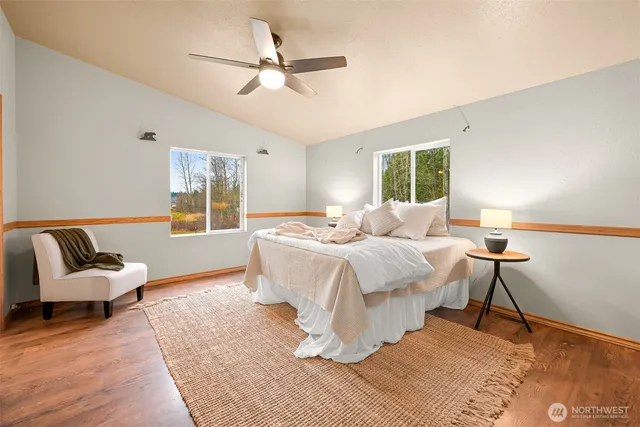 a bedroom with a bed and a couch