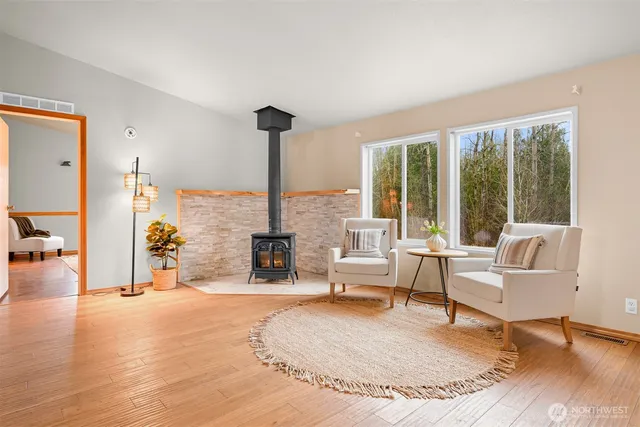 a living room with furniture and large windows