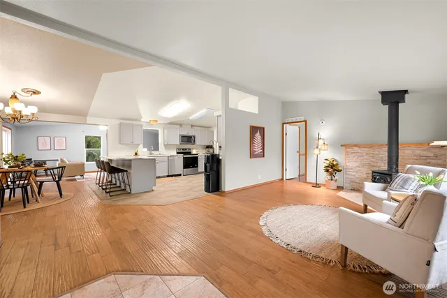 a living room with furniture and kitchen view