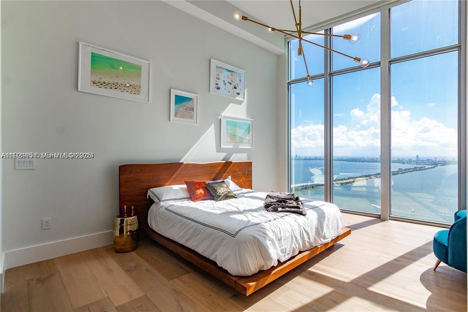 2900 Northeast 7th Avenue, Unit 5002 Miami, FL 33137 - Photo 11 of 24 a bedroom with a bed and a window