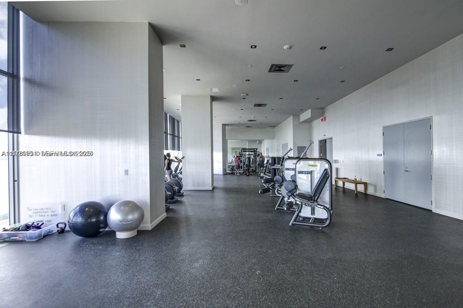 2900 Northeast 7th Avenue, Unit 5002 Miami, FL 33137 - Photo 21 of 24 a view of a room with gym equipment