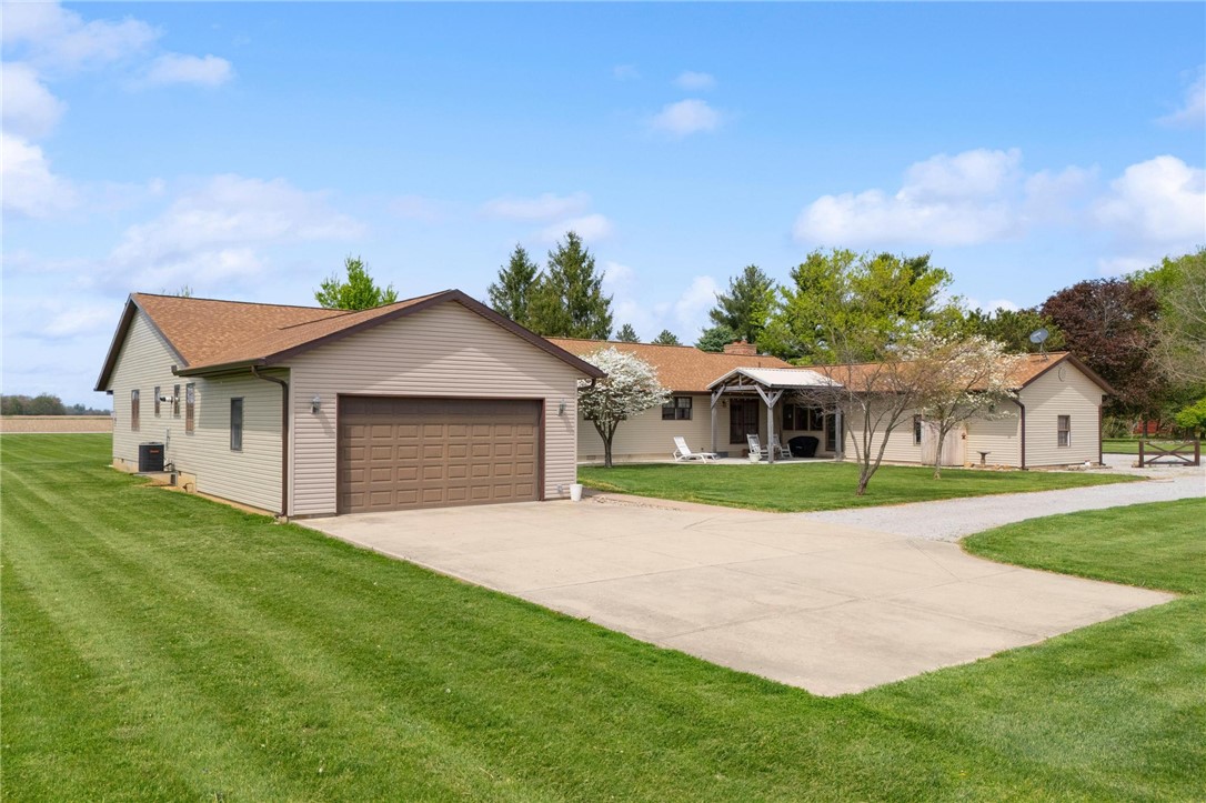4971 Lackey Road Cedarville, OH 45314 - Photo 4 of 79 This ranch-style residence features a spacious concrete driveway and a well-maintained surrounding lawn.