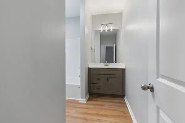 a bathroom with a sink and a mirror