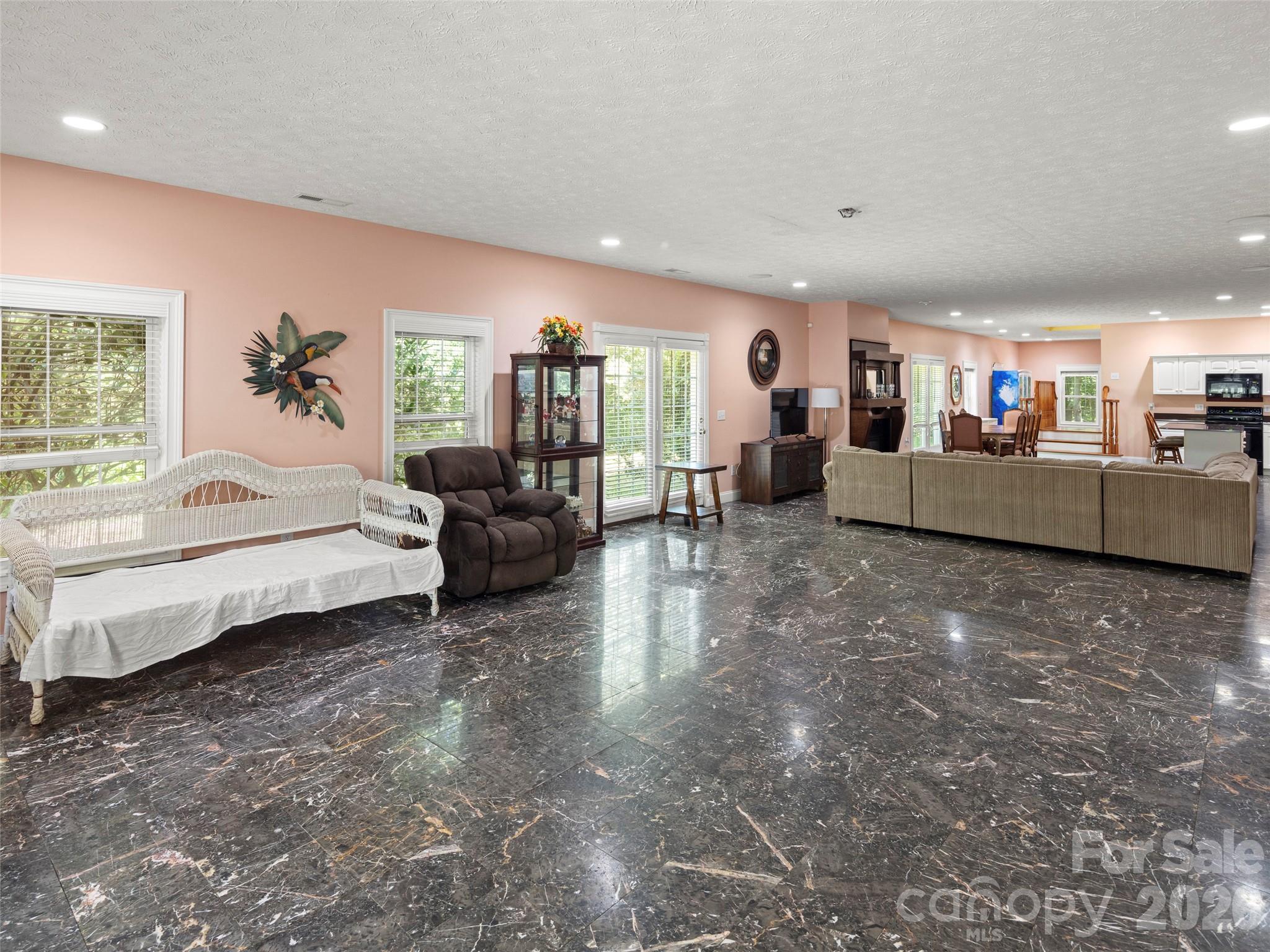 4901 Brevard Road Horse Shoe, NC 28742 - Photo 12 of 34 a living room with furniture and a flat screen tv