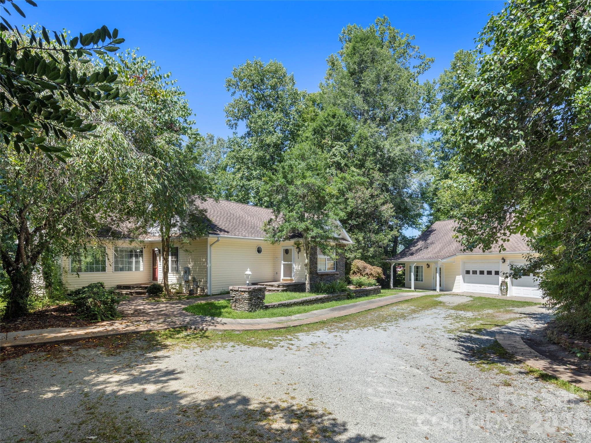 4901 Brevard Road Horse Shoe, NC 28742 - Photo 16 of 34 a front view of a house with a yard
