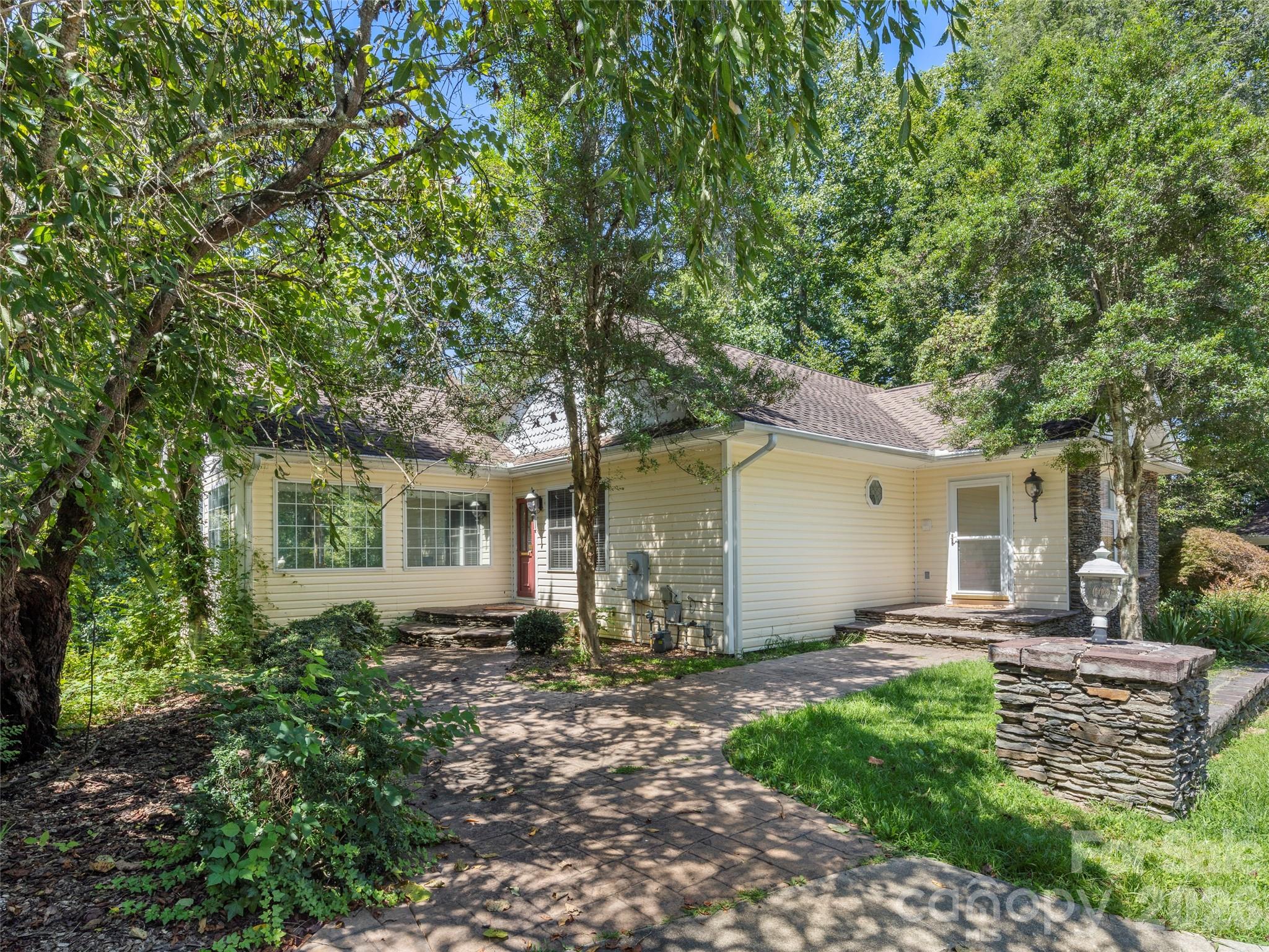 4901 Brevard Road Horse Shoe, NC 28742 - Photo 17 of 34 a front view of house with yard and green space