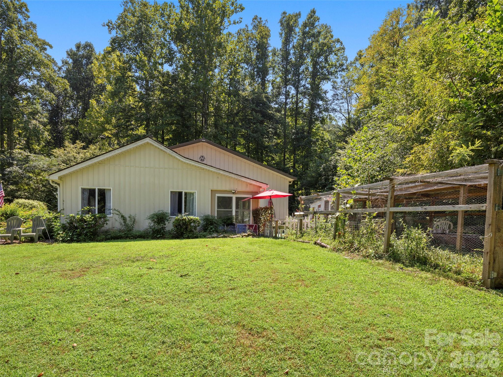 4901 Brevard Road Horse Shoe, NC 28742 - Photo 27 of 34 a front view of house with yard and green space