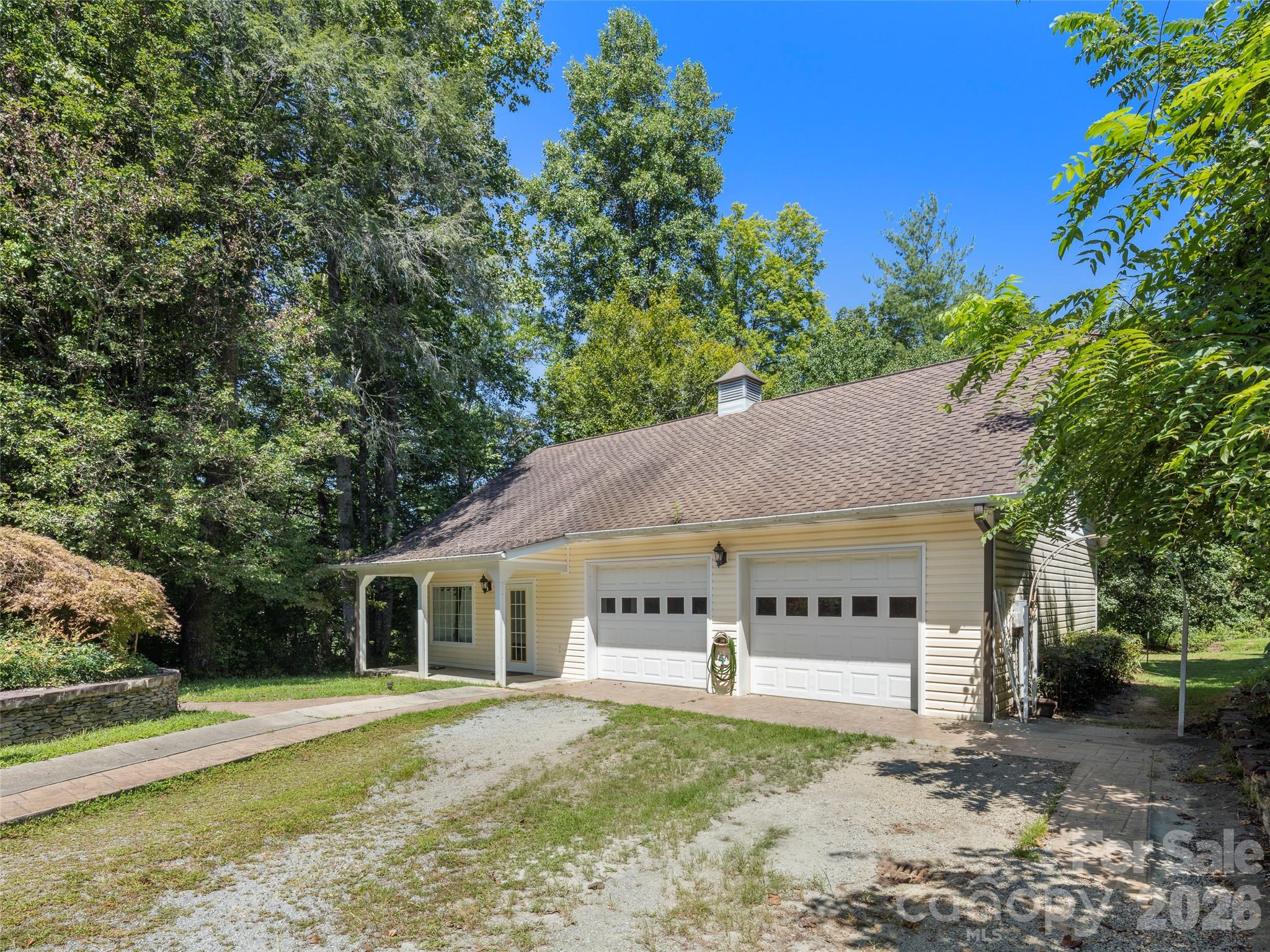 4901 Brevard Road Horse Shoe, NC 28742 - Photo 29 of 34 a view of white house with a big yard and large trees