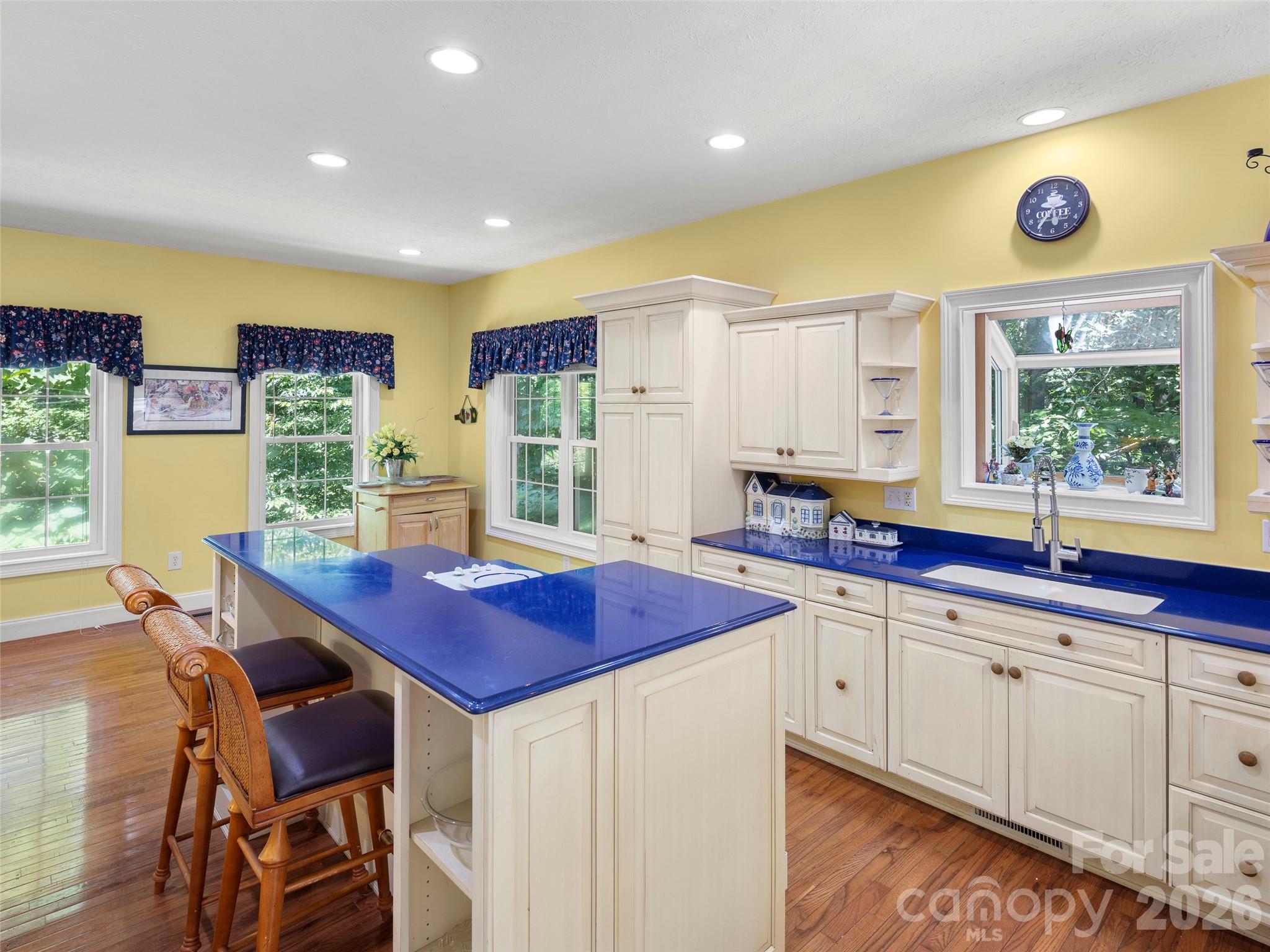 4901 Brevard Road Horse Shoe, NC 28742 - Photo 7 of 34 a kitchen with stainless steel appliances granite countertop a stove a sink and a refrigerator