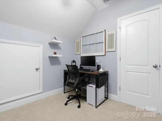 a view of a workspace with furniture