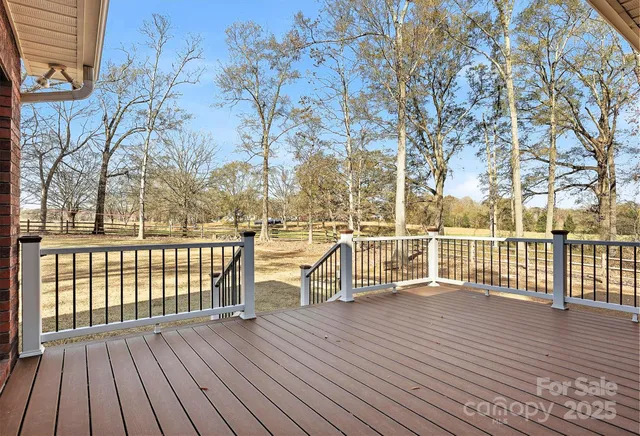 a view of a balcony with wooden floor