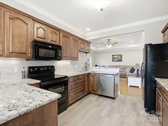 a kitchen with a sink stove and microwave