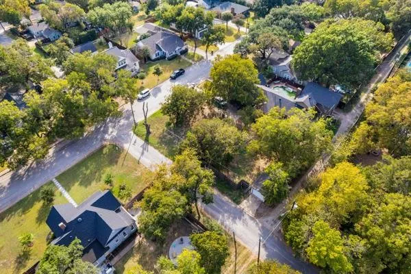 an aerial view of residential house with swimming pool