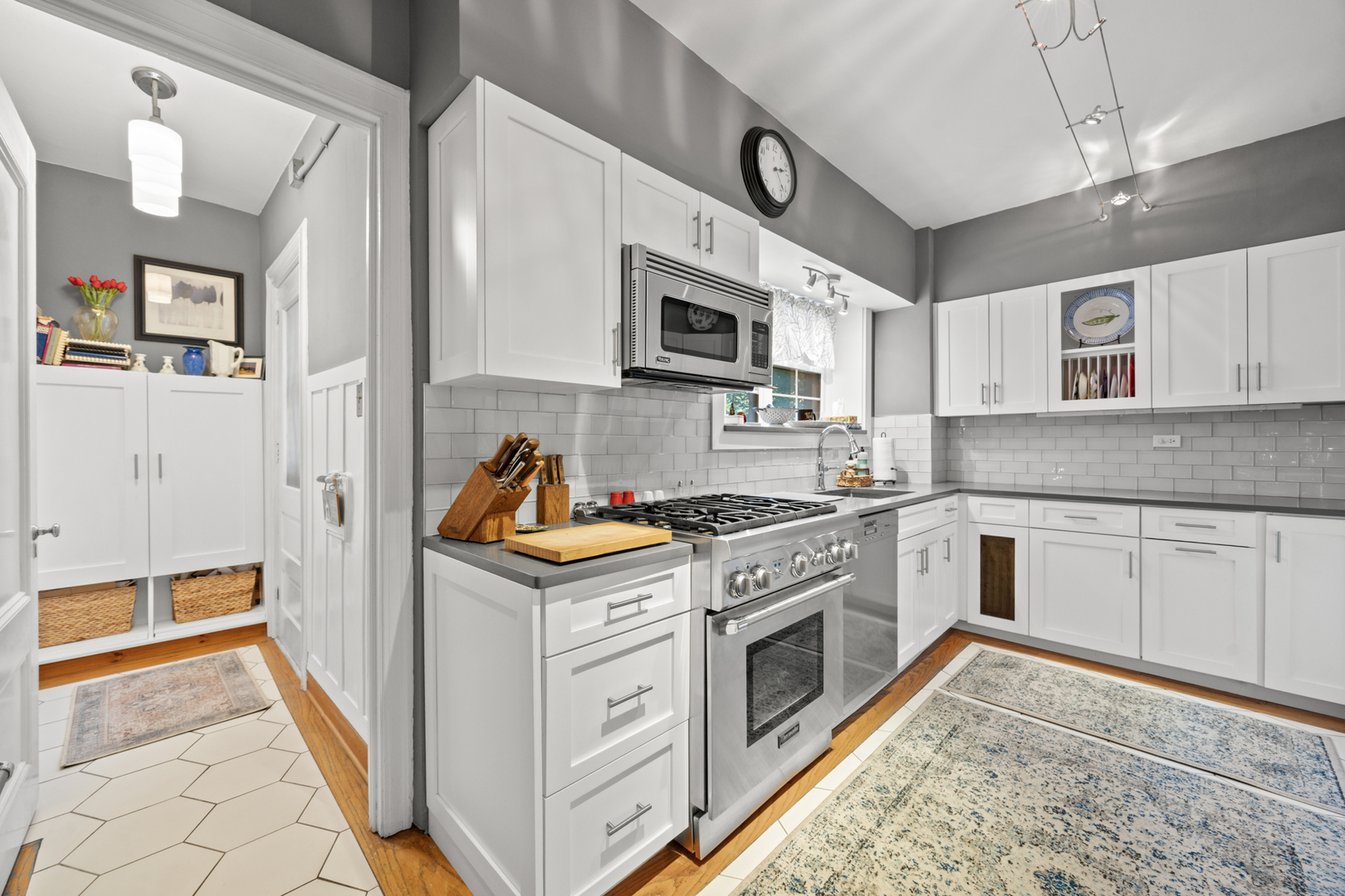 5510 North Sheridan Road, Unit 2A Chicago, IL 60640 - Photo 14 of 36 a kitchen with stainless steel appliances granite countertop a stove and a sink