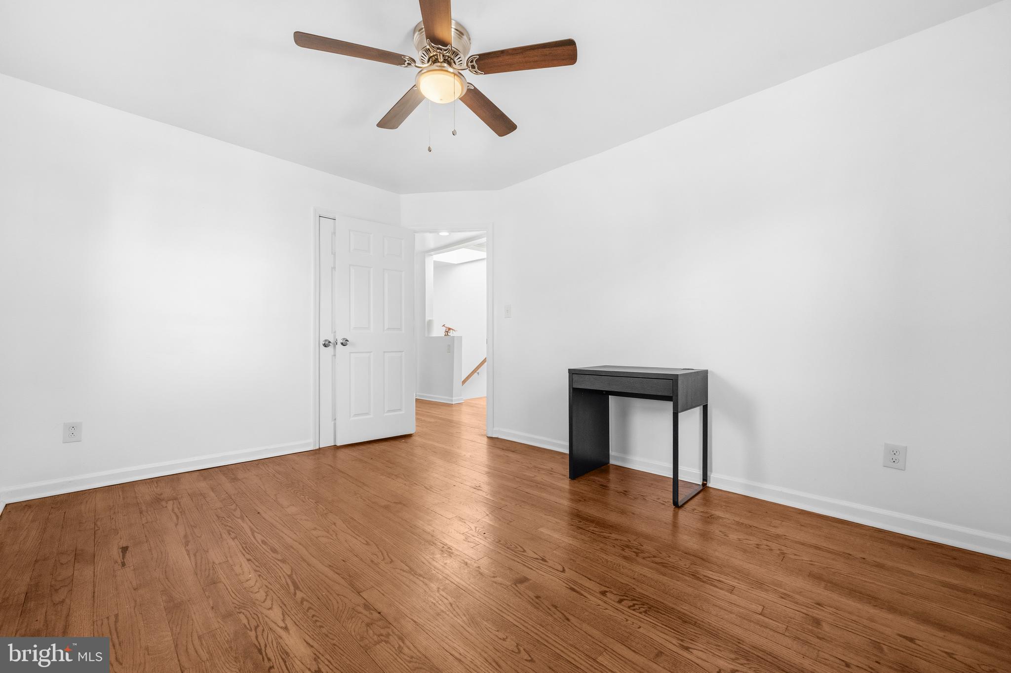 520 49th Street Northeast Washington, DC 20019 - Photo 16 of 38 an empty room with wooden floor and ceiling fan