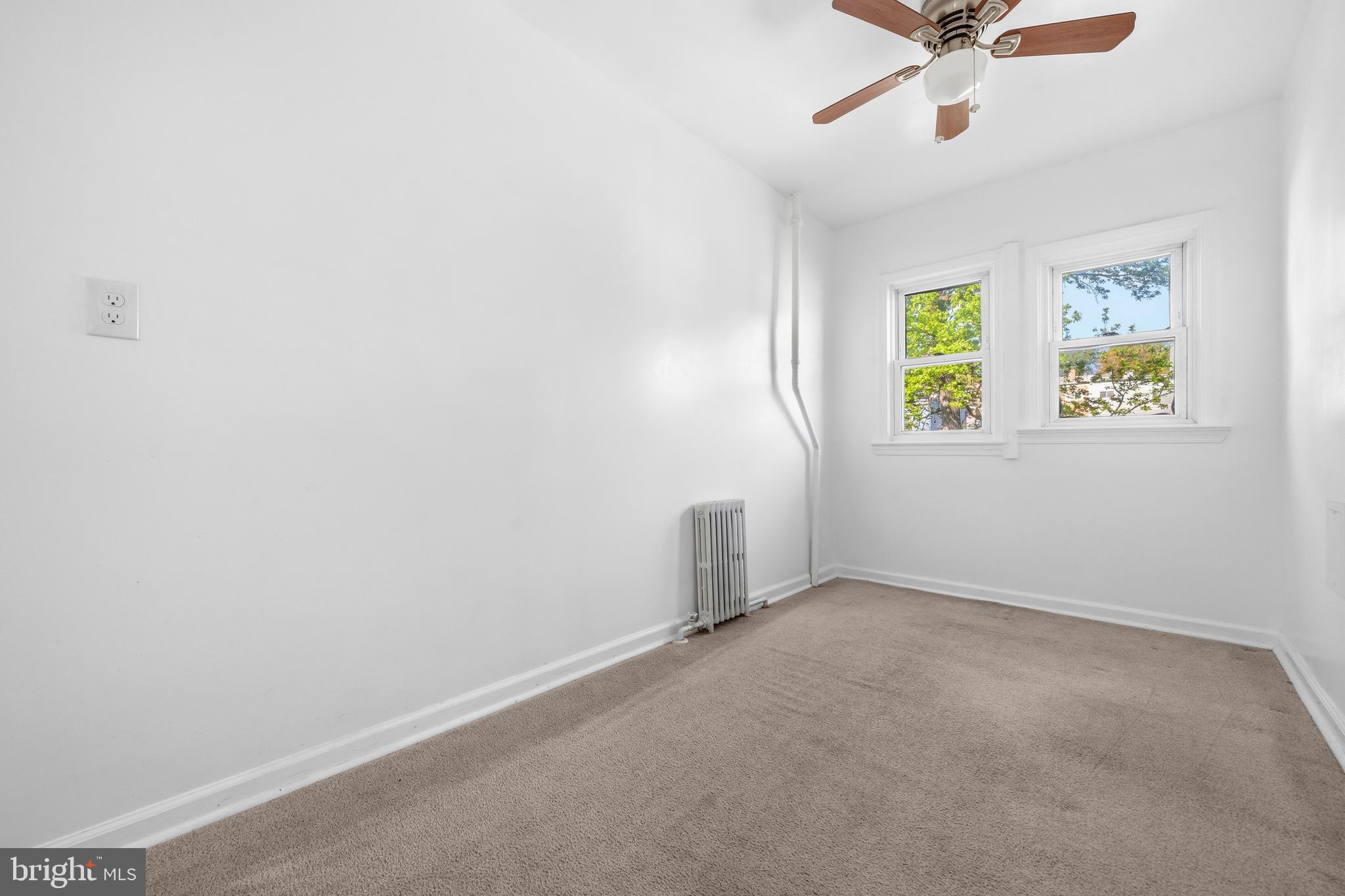 520 49th Street Northeast Washington, DC 20019 - Photo 23 of 38 an empty room with a window and a fan