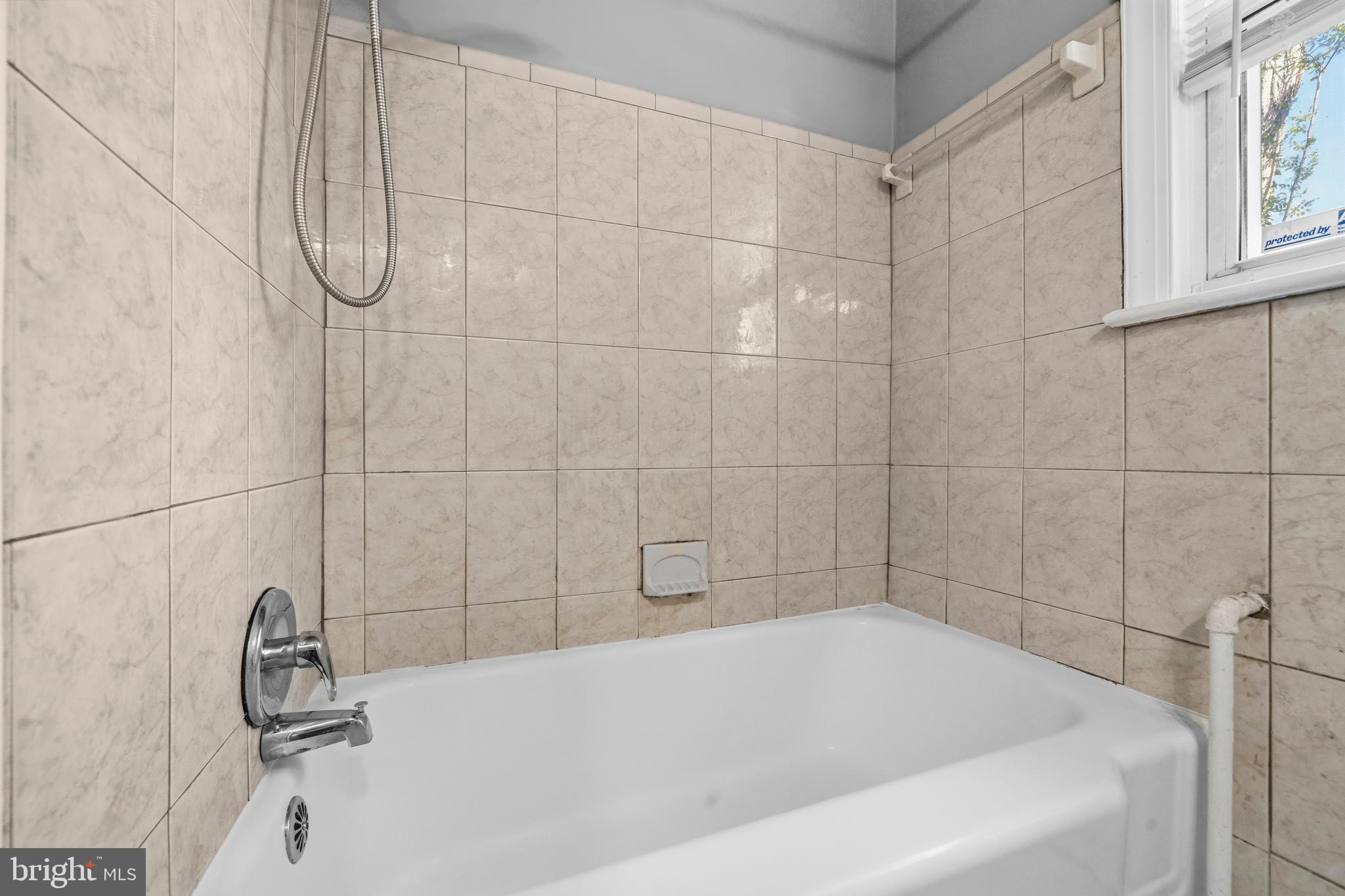 520 49th Street Northeast Washington, DC 20019 - Photo 26 of 38 a bathroom with a bath tub with a shower