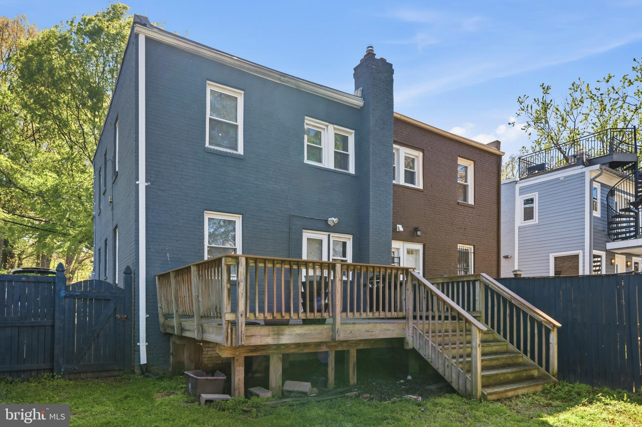 520 49th Street Northeast Washington, DC 20019 - Photo 32 of 38 a view of a house with a deck and a yard