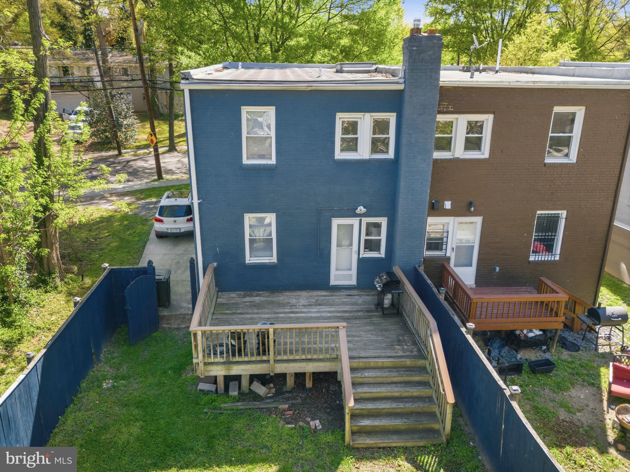 520 49th Street Northeast Washington, DC 20019 - Photo 34 of 38 a view of a house with backyard and wooden deck