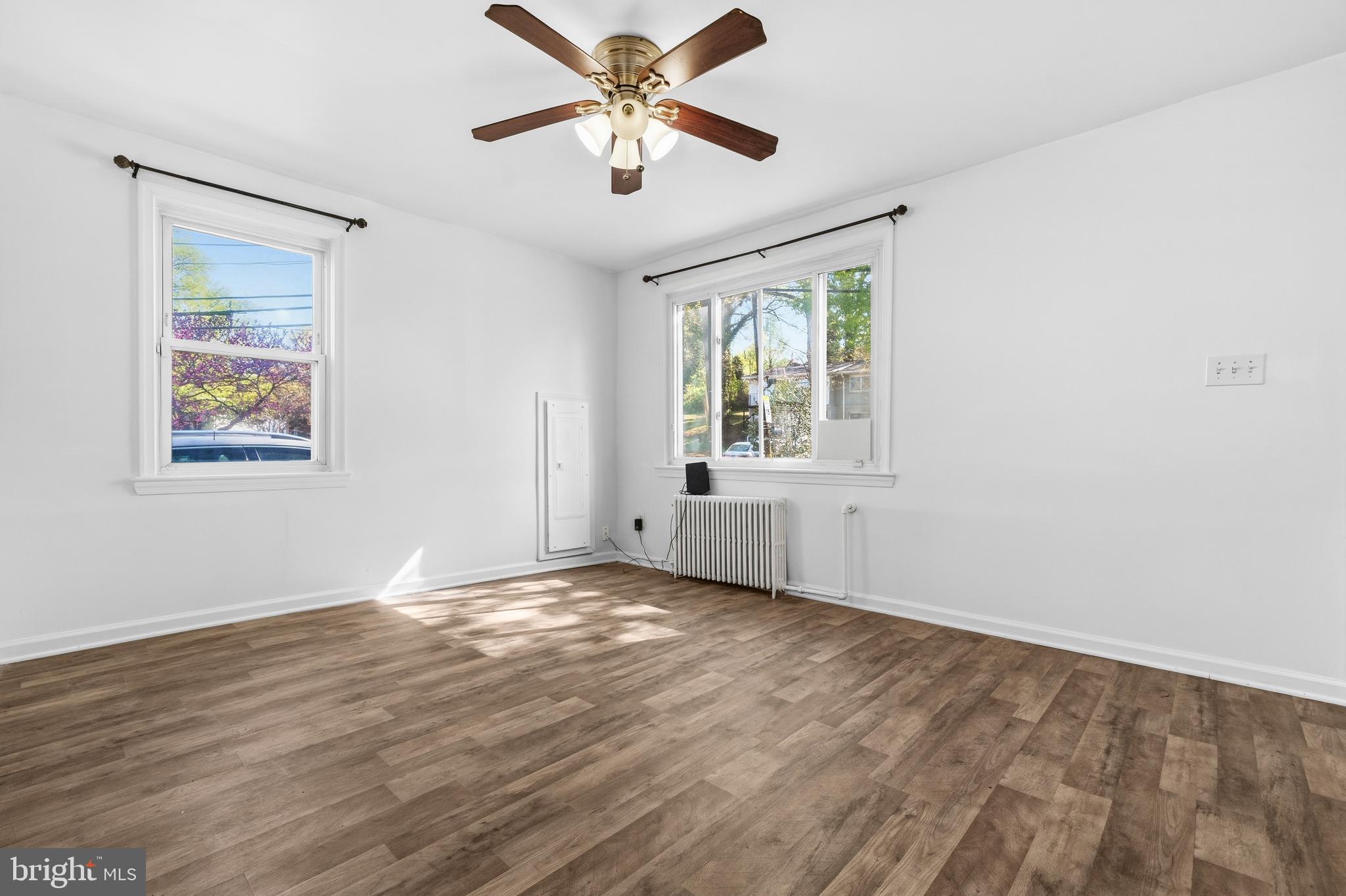 520 49th Street Northeast Washington, DC 20019 - Photo 5 of 38 wooden floor in an empty room with a window
