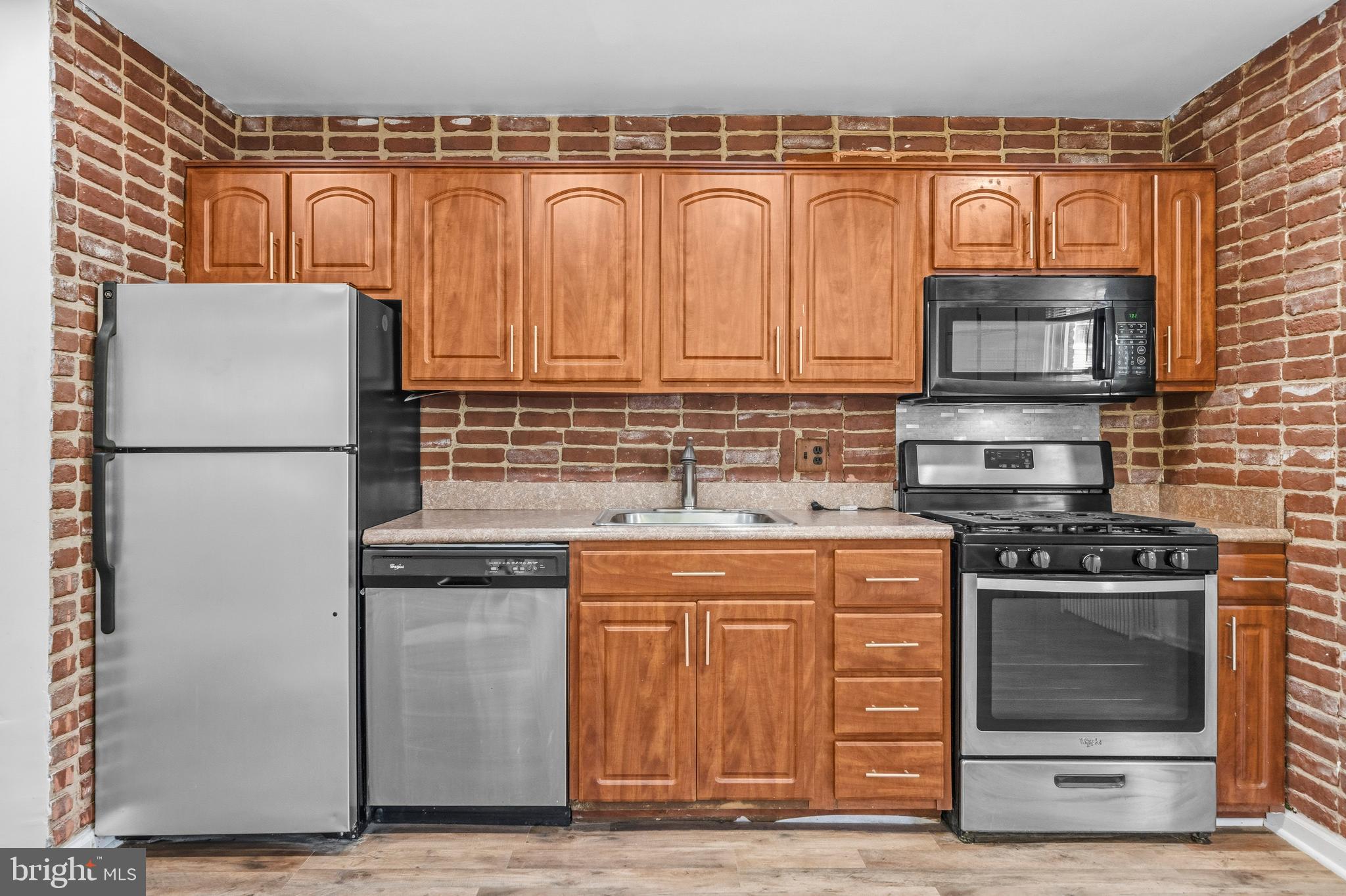 520 49th Street Northeast Washington, DC 20019 - Photo 10 of 38 a kitchen with stainless steel appliances granite countertop a stove a refrigerator and a cabinets