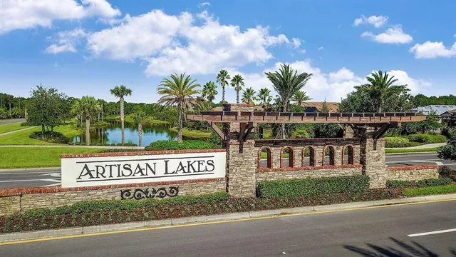 a view of a patio with a table and chairs under an umbrella
