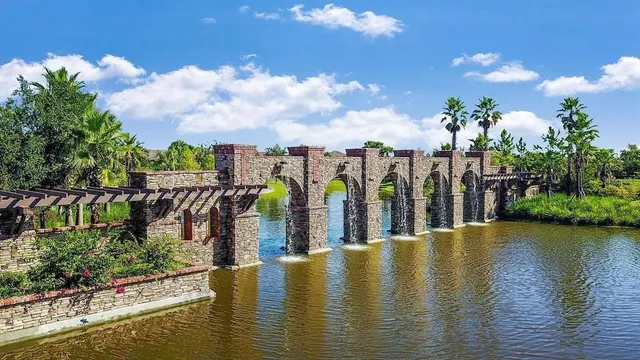 a view of a patio with a dining table and chairs