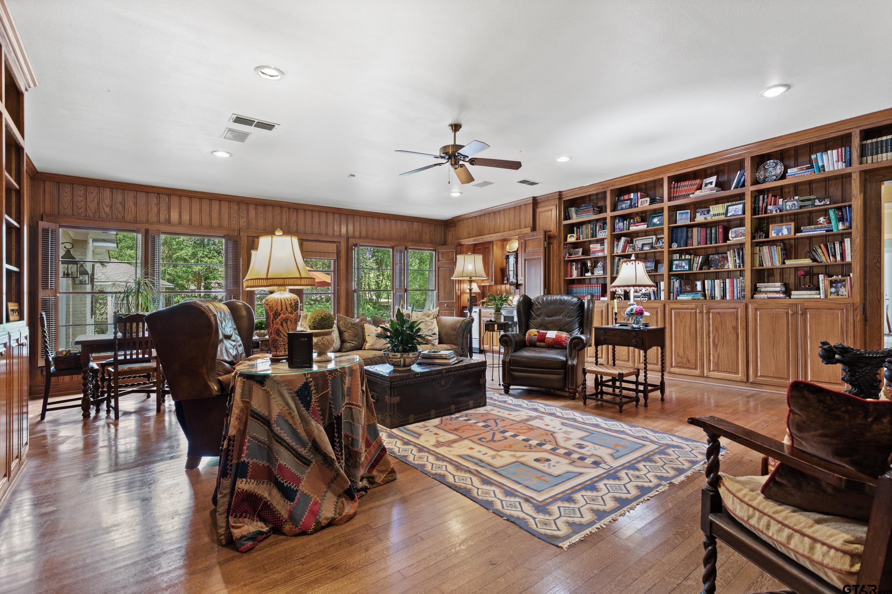 2631 Old Bullard Road Tyler, TX 75701 - Photo 11 of 43 a living room with furniture a rug and a large window