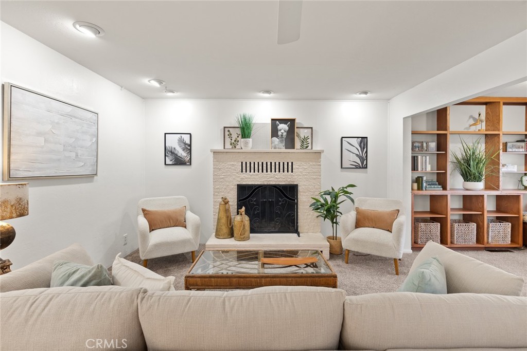 1075 Tracy Lane Chico, CA 95926 - Photo 11 of 29 a living room with furniture and a fireplace