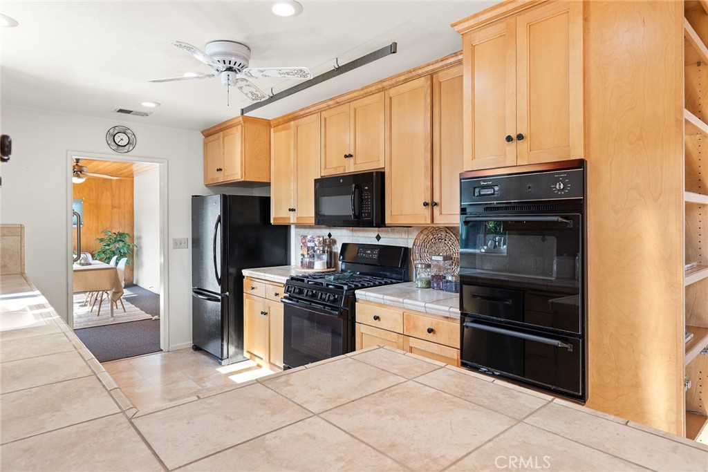 1075 Tracy Lane Chico, CA 95926 - Photo 14 of 29 a kitchen with stainless steel appliances a stove sink and microwave