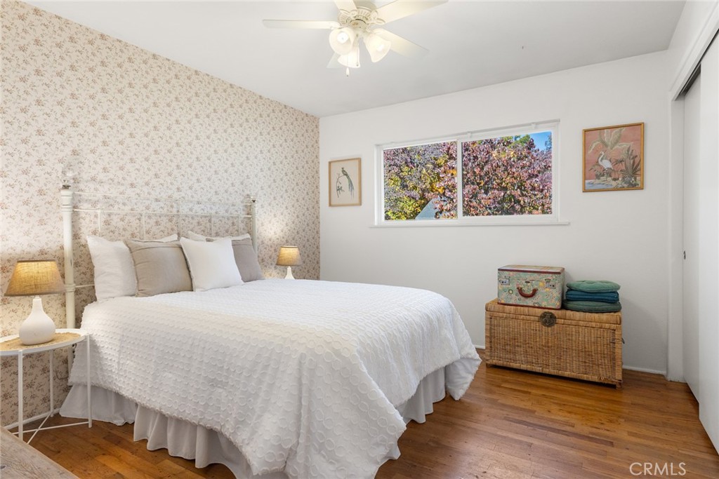 1075 Tracy Lane Chico, CA 95926 - Photo 18 of 29 a bedroom with a bed and a chandelier