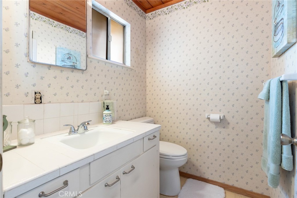 1075 Tracy Lane Chico, CA 95926 - Photo 22 of 29 a bathroom with a sink a toilet and shower