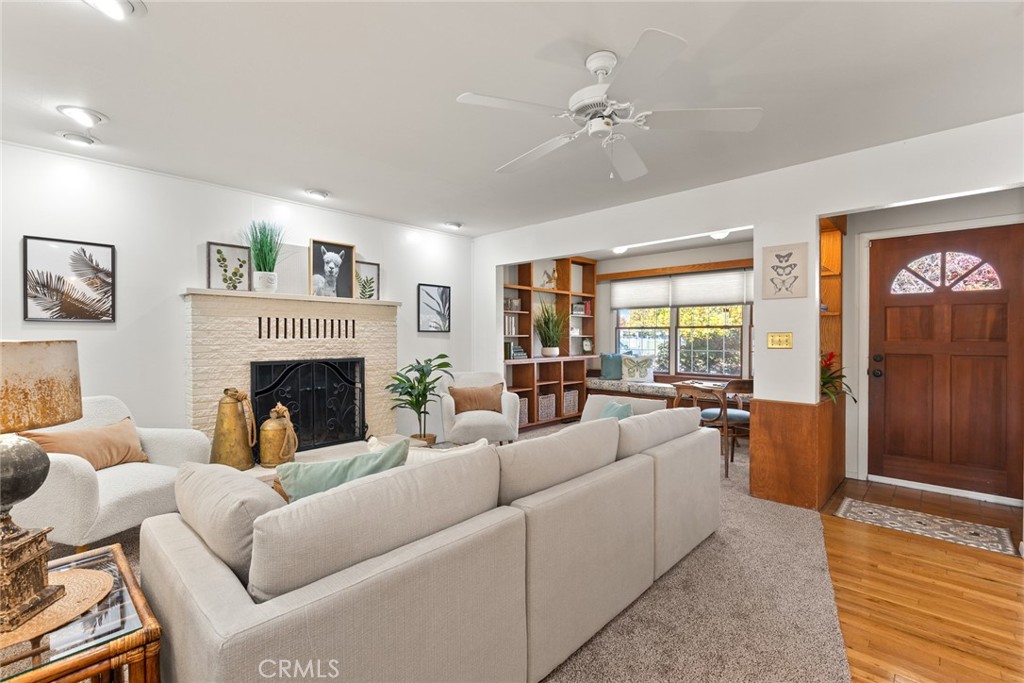 1075 Tracy Lane Chico, CA 95926 - Photo 6 of 29 a living room with furniture large window and a fireplace