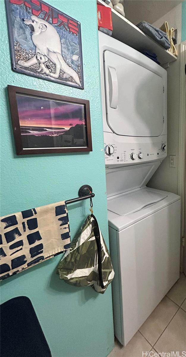 94-510 Lumiaina Street, Unit M103 Waipahu, HI 96797 - Photo 15 of 24 a room with furniture and a flat screen tv