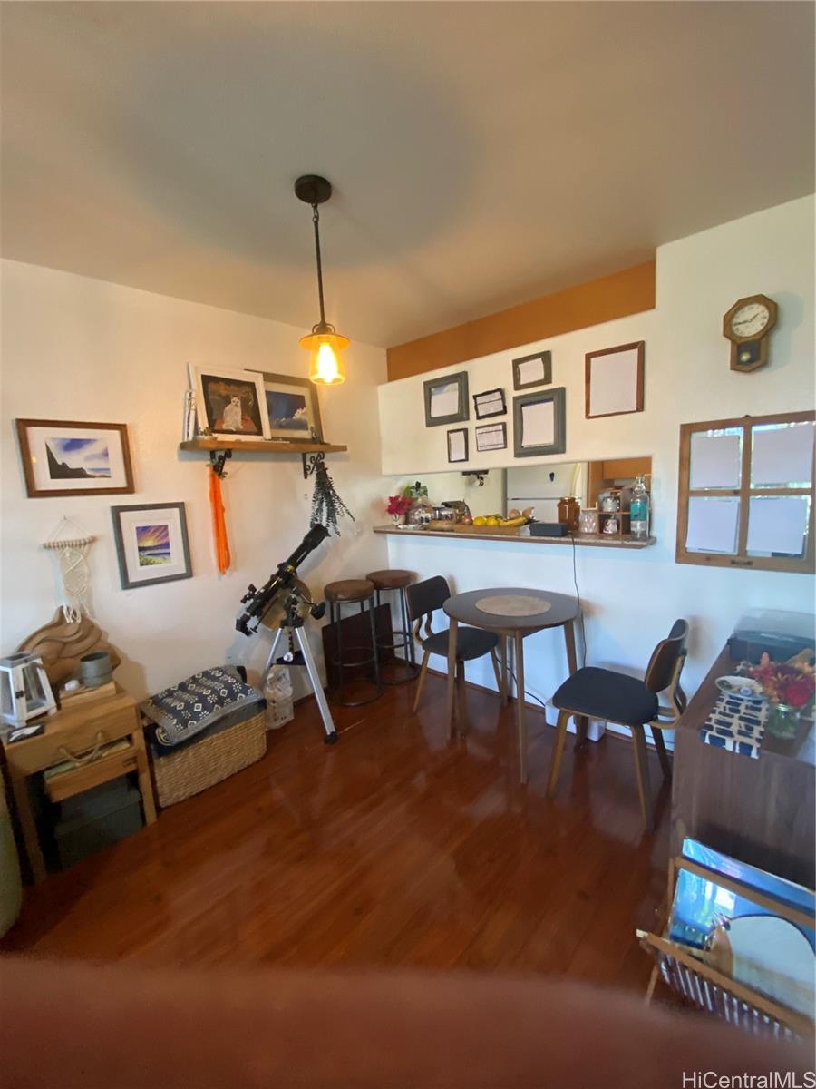 94-510 Lumiaina Street, Unit M103 Waipahu, HI 96797 - Photo 8 of 24 a living room with furniture and wooden floor