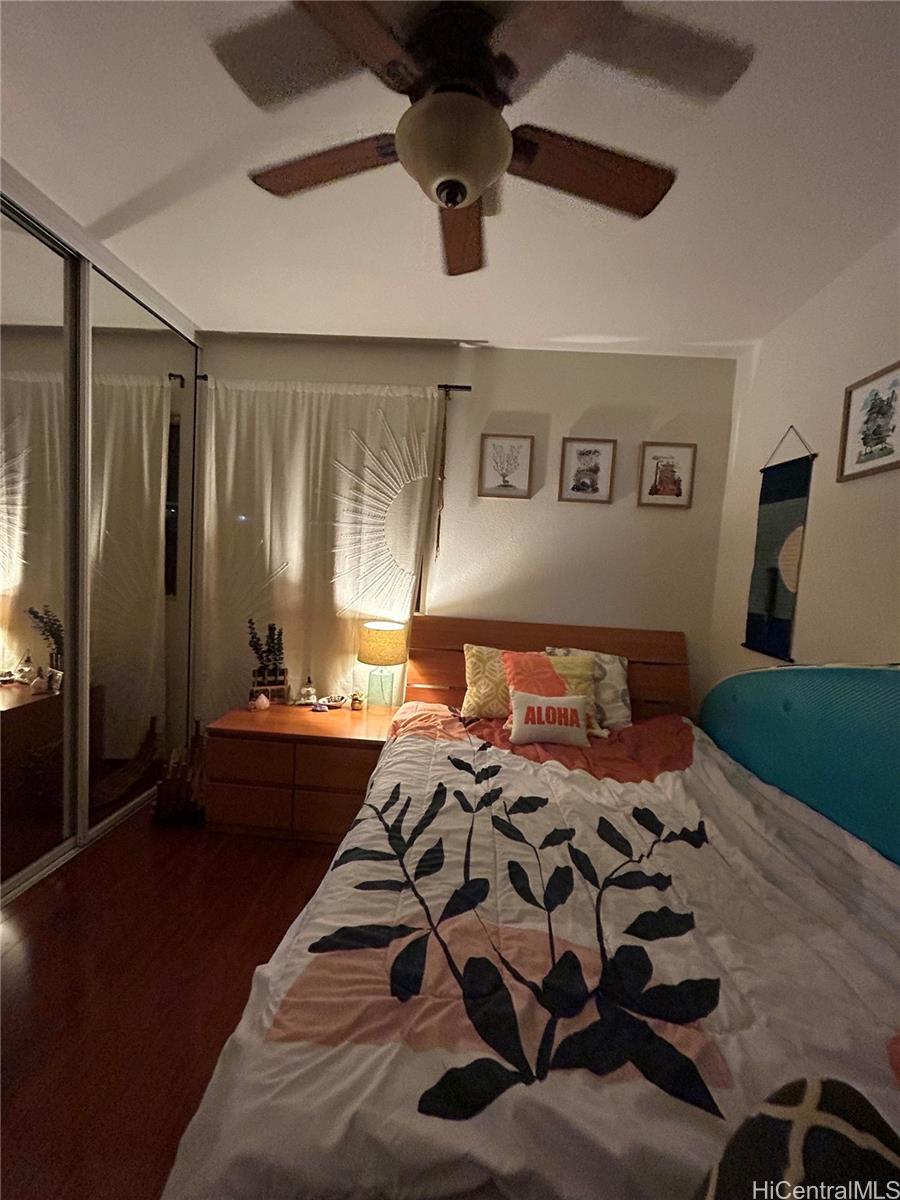 94-510 Lumiaina Street, Unit M103 Waipahu, HI 96797 - Photo 9 of 24 a bed sitting in a bedroom next to a window