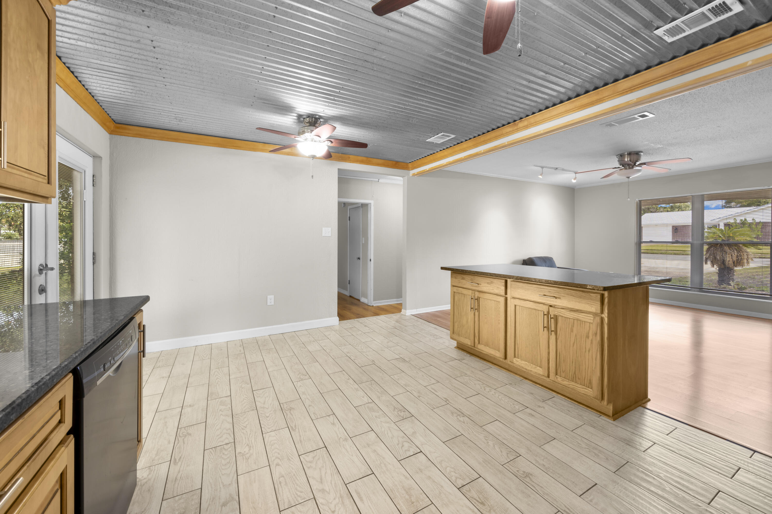 307 Spring Lane Destin, FL 32541 - Photo 13 of 42 a kitchen with granite countertop a stove a sink and a refrigerator