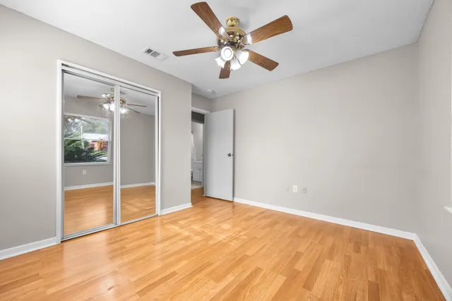 a bathroom with a sink mirror vanity and toilet