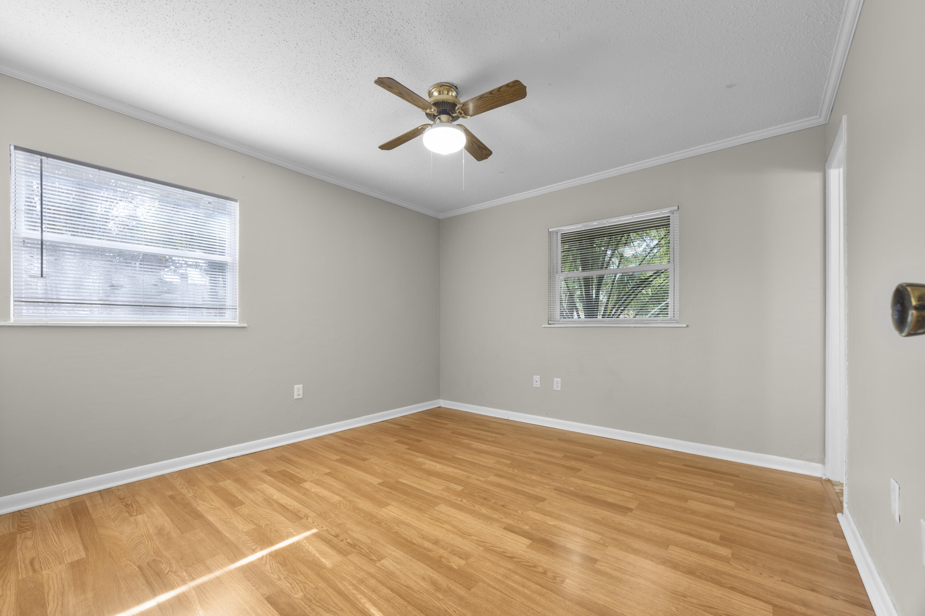 307 Spring Lane Destin, FL 32541 - Photo 21 of 42 a view of a big room with wooden floor and windows
