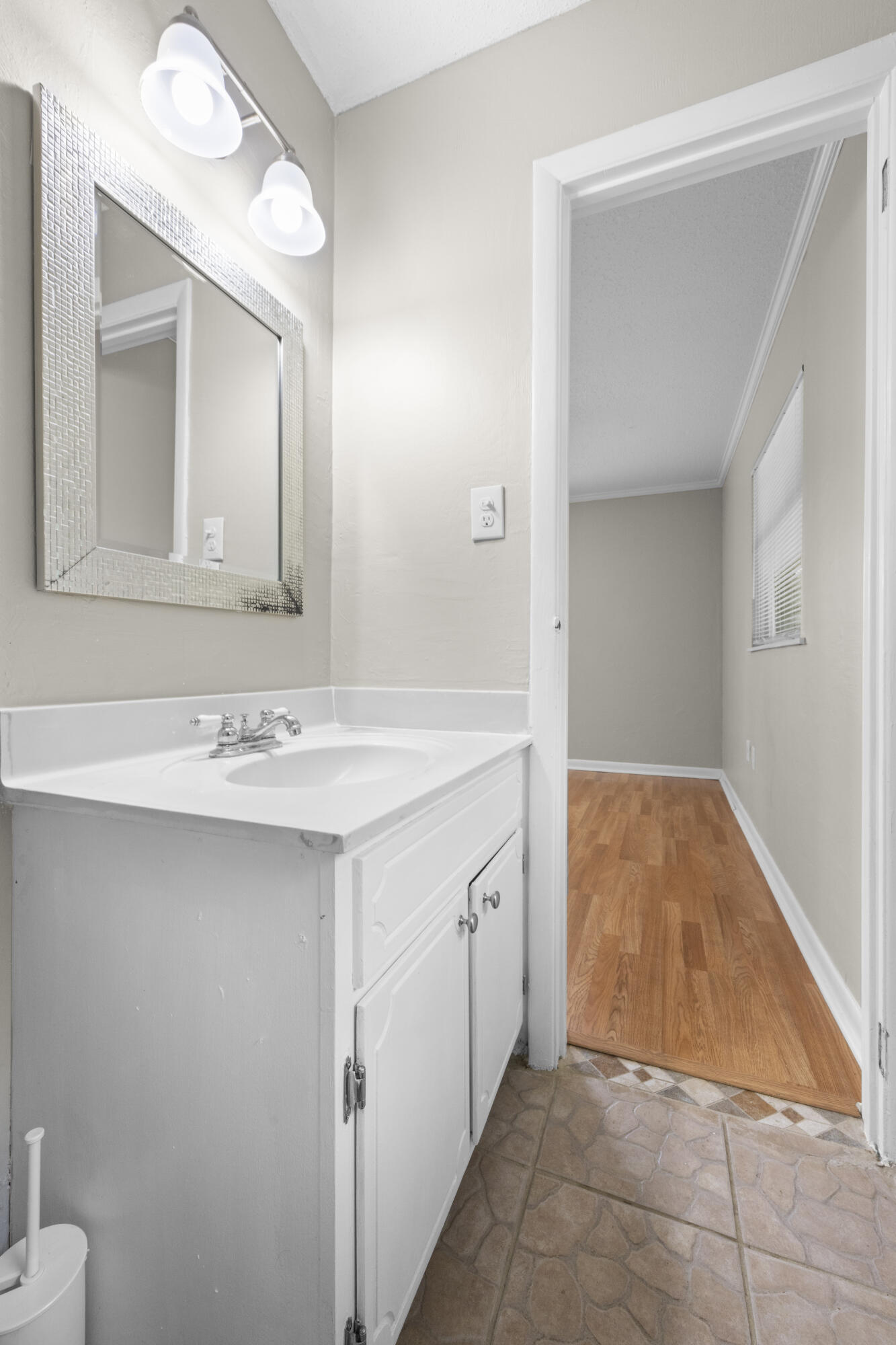 307 Spring Lane Destin, FL 32541 - Photo 24 of 42 a bathroom with a sink and a mirror