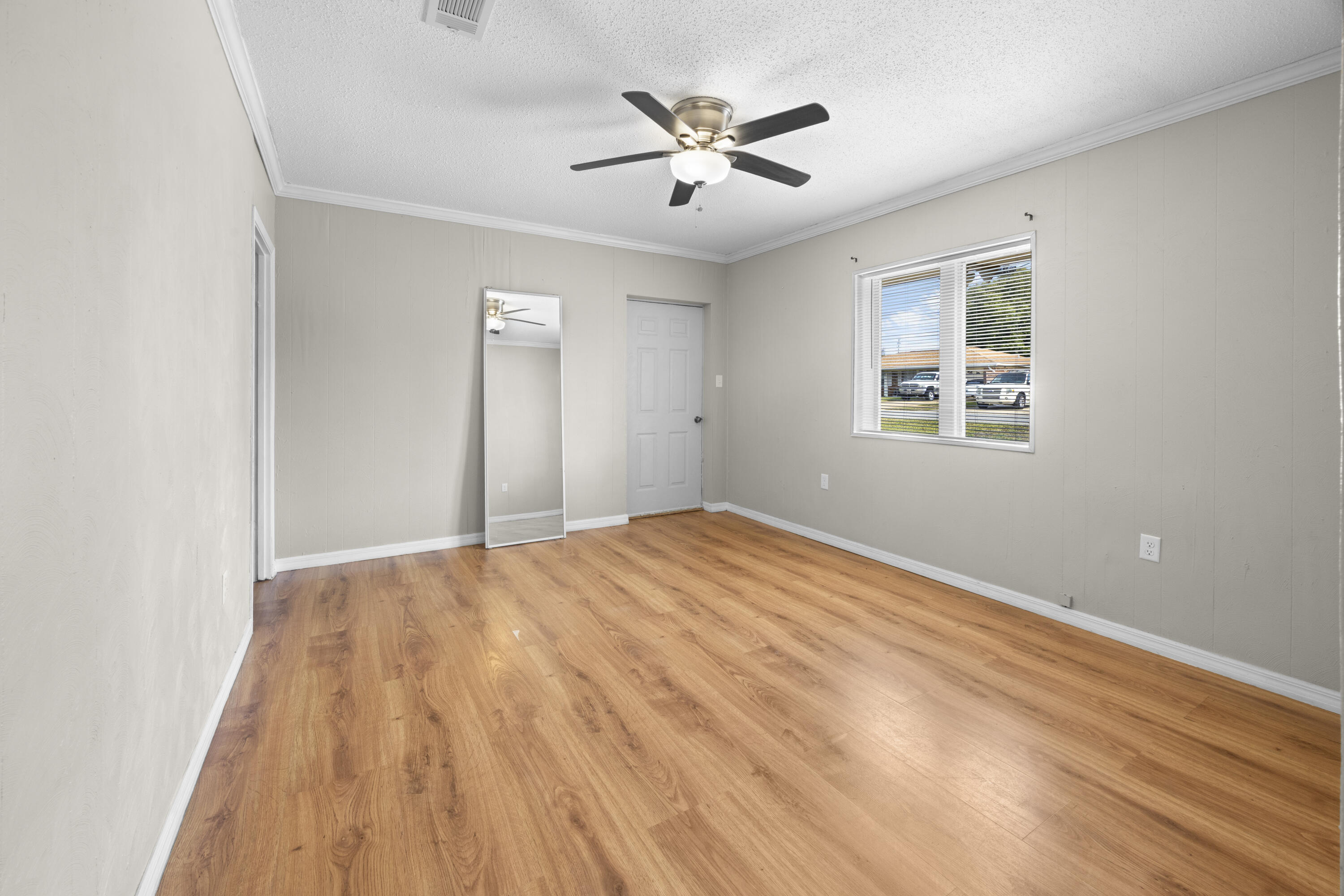 307 Spring Lane Destin, FL 32541 - Photo 32 of 42 a view of empty room with wooden floor and fan