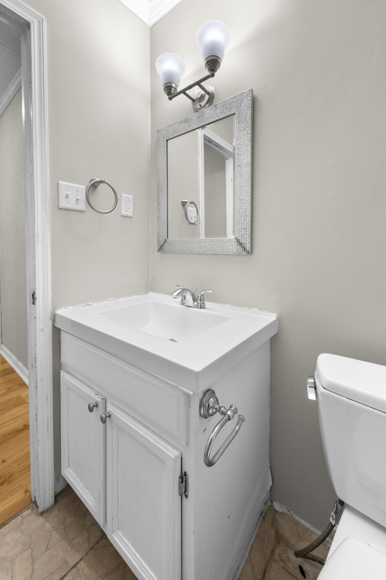 307 Spring Lane Destin, FL 32541 - Photo 35 of 42 a bathroom with a sink mirror vanity and toilet