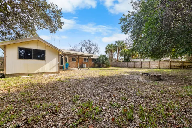 a kitchen with stainless steel appliances granite countertop a sink cabinets and a refrigerator