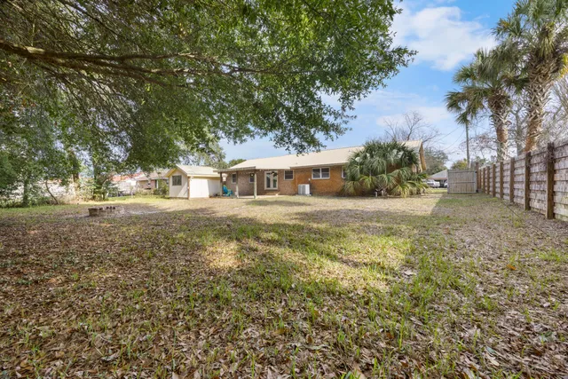 a view of a kitchen with a sink and cabinets