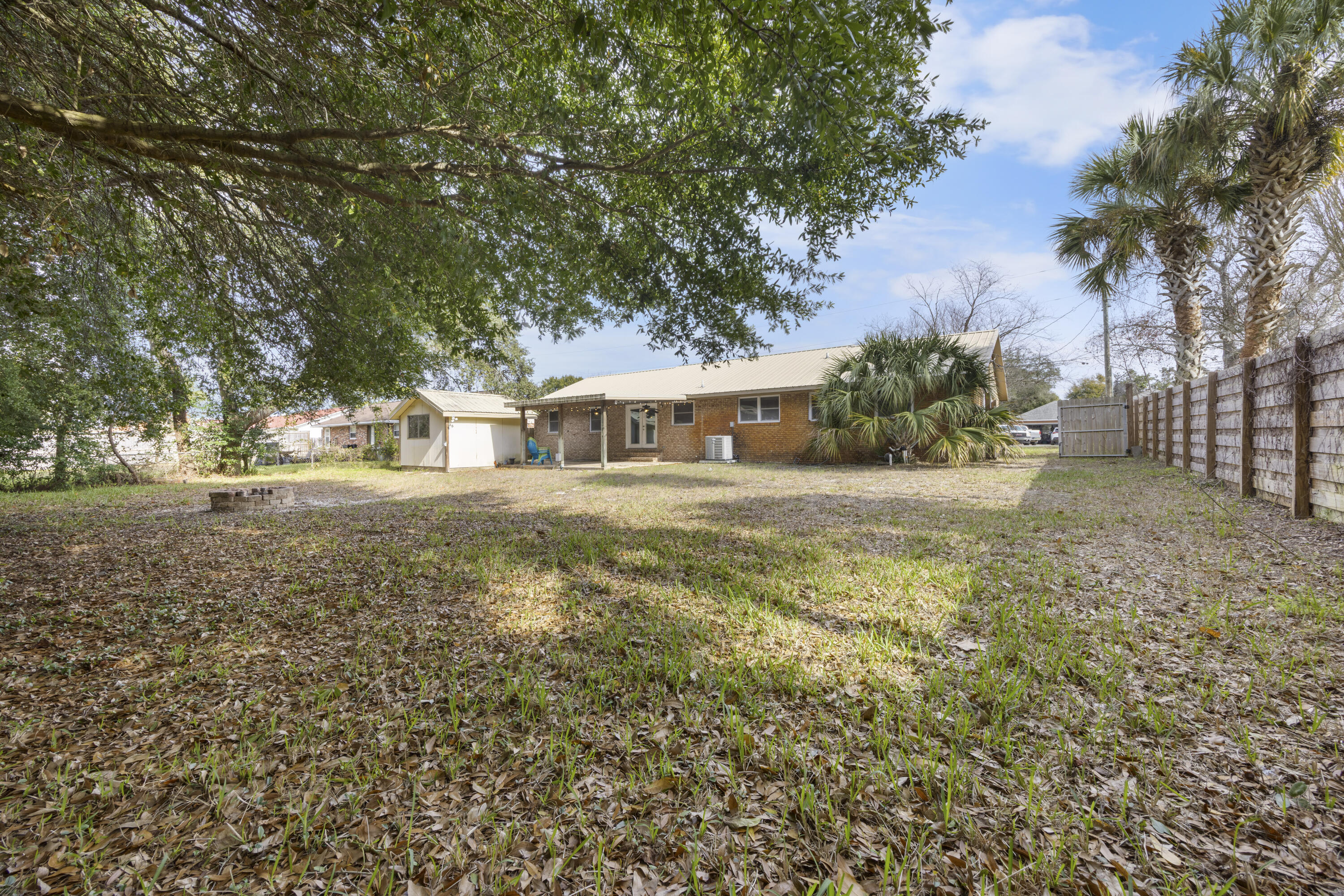 307 Spring Lane Destin, FL 32541 - Photo 9 of 42 a house view with swimming pool in front of it
