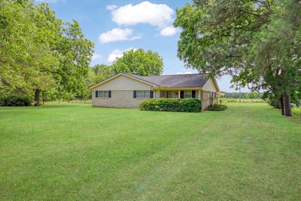 4400 Highway 121 Bonham, TX 75418 - Photo 1 of 40 a house view with a garden space