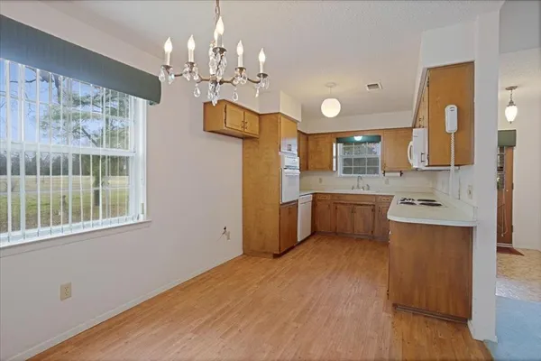 a kitchen with stainless steel appliances granite countertop a sink and cabinets