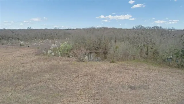 a view of an ocean beach and mountain