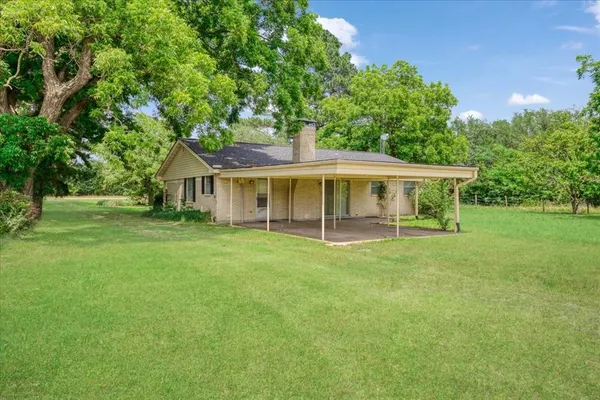 a view of house with a garden
