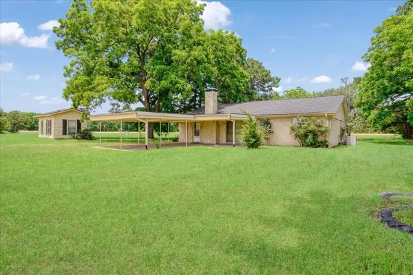 a view of house with outdoor space